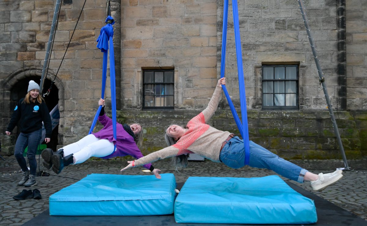Young people perform on aerial workshops